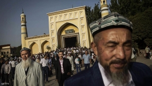 KASHGAR, CHINA - JULY 29: Uyghur men leave the Id Kah Mosque following the Eid prayers on July 29, 2014 in old Kashgar, Xinjiang Uyghur Autonomous Region, China. Nearly 100 people have been killed in unrest in the restive Xinjiang Uyghur Autonomous Region in the last week in what authorities say is terrorism but advocacy groups claim is a result of a government crackdown to silence opposition to its policies. China's Muslim Uyghur ethnic group faces cultural and religious restrictions by the Chinese government. Beijing says it is investing heavily in the Xinjiang region but Uyghurs are increasingly dissatisfied with the influx of Han Chinese and uneven economic development. (Photo by Kevin Frayer/Getty Images)