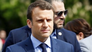 French centrist presidential candidate Emmanuel Macron arrives for a ceremony marking 102nd anniversary of the slaying of Armenians by Ottoman Turks in a brief ceremony, Monday April 24, 2017 in Paris. Macron, a centrist with pro-business, pro-European views, will face far-right leader Marine Le Pen in the May 7 runoff of the presidential election. (AP Photo/Francois Mori)